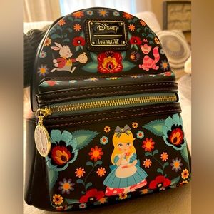 NWT Loungefly Disney’s Alice In Wonderland storybook flower mini backpac…